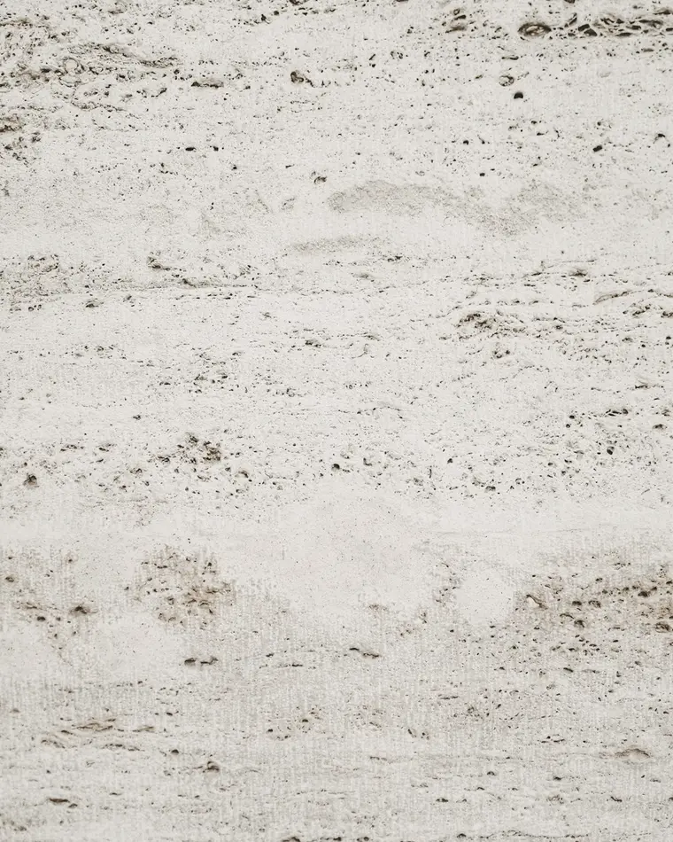 Close-up visual reference of pale vein-cut travertine
