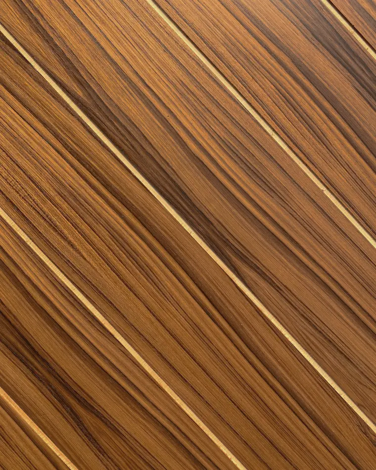 Close-up visual reference of golden teak grain